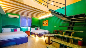 A room with two beds, a staircase, a small table, and a bench. - Oasis Inn (Hengchun)