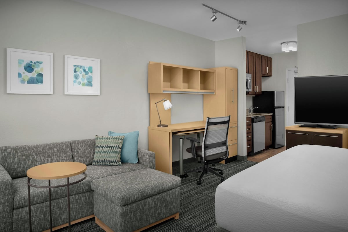 Studio Suite, 1 King Bed with Sofa bed | Living area | 32-inch LCD TV with satellite channels, TV