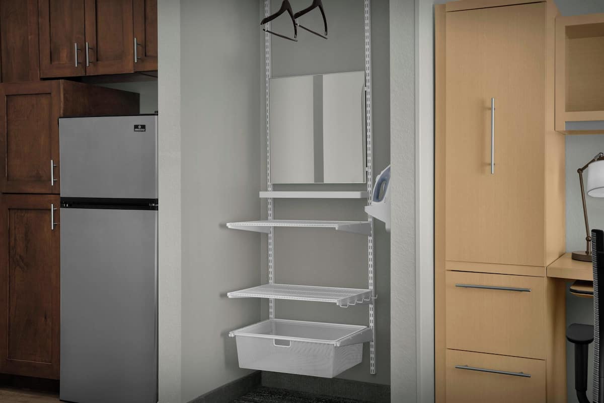 Premium bedding, desk, laptop workspace, blackout drapes