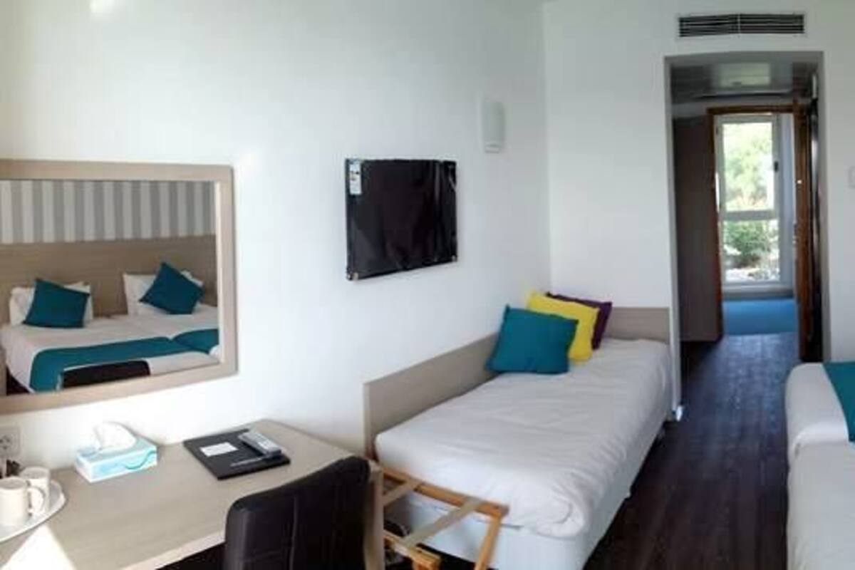Standard Twin Room, Sea View, Beachfront | Minibar, in-room safe, desk, free WiFi