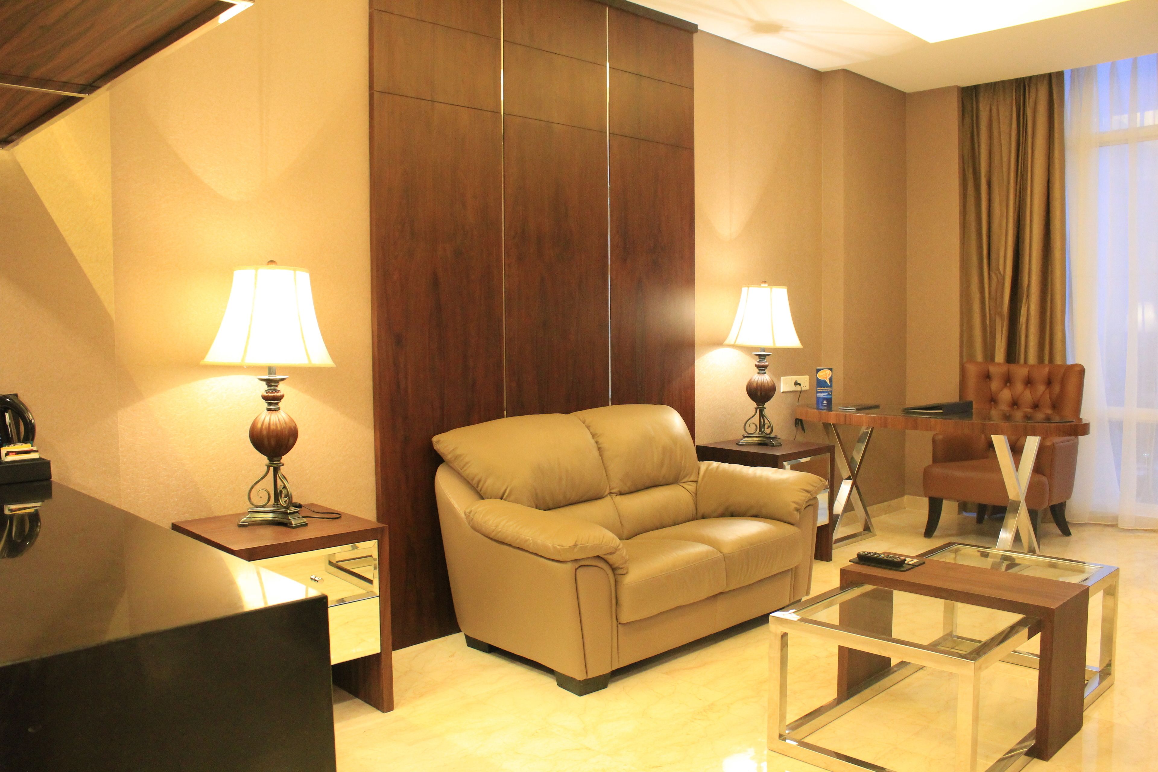 presidential suite, 1 double bed, smoking, city view | living room | tv, dvd player