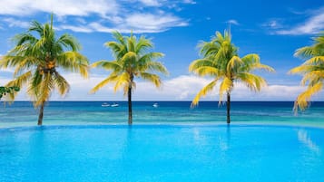 Outdoor pool, pool umbrellas, sun loungers