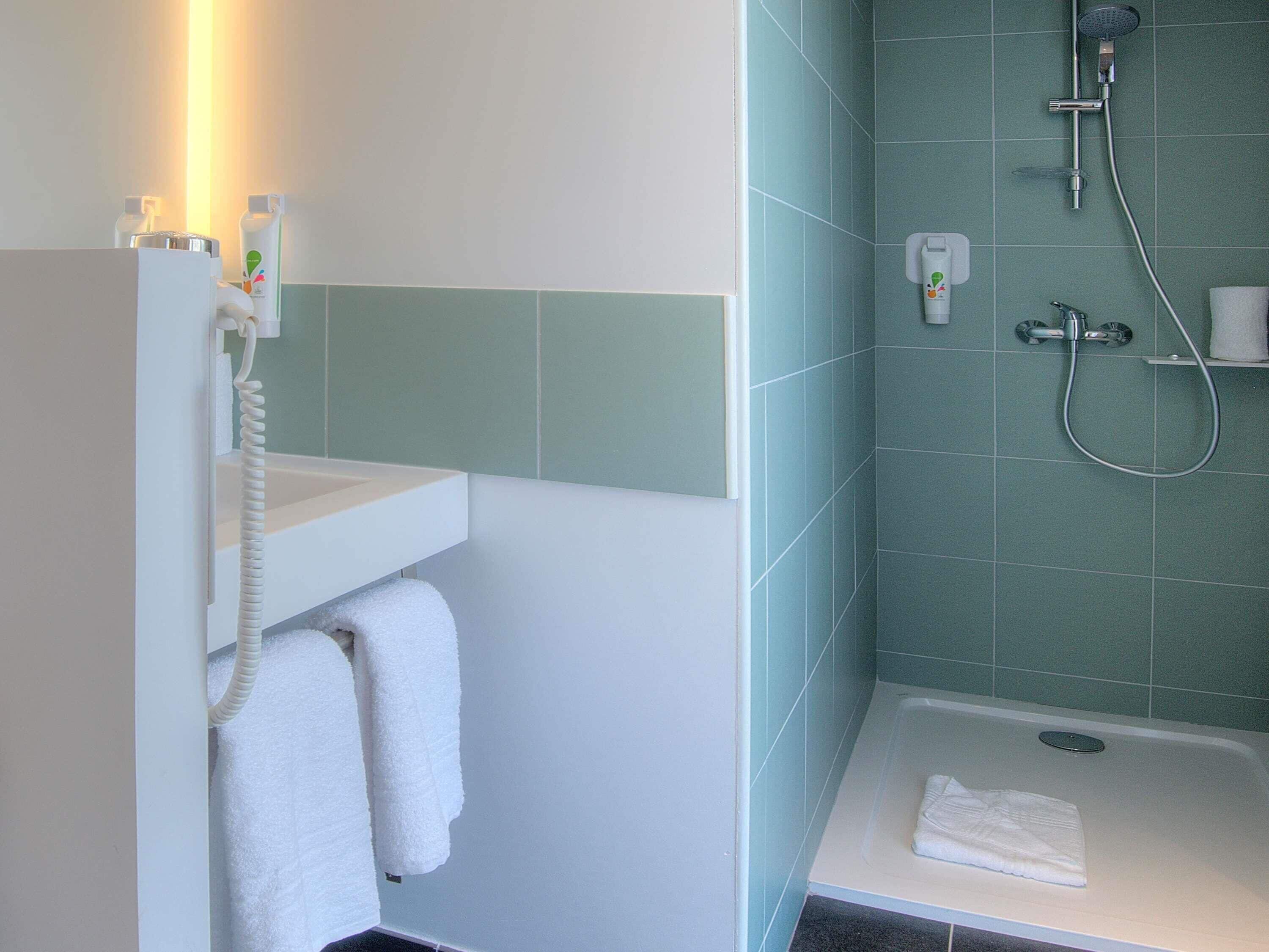 Shower, eco-friendly toiletries, hair dryer, towels