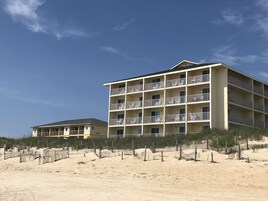On the beach, sun loungers, beach towels, windsurfing