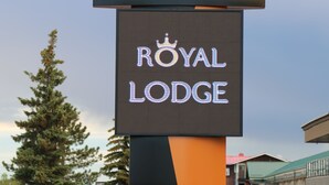 A sign for Royal Lodge with a prominent 'R' logo, indicating the hotel name. - Royal Lodge (Edmonton)