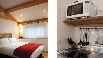 Escritorio, tabla de planchar con plancha, camas extra y ropa de cama