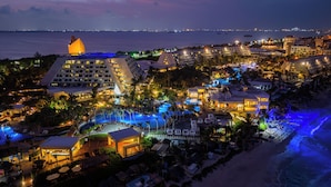 A resort with multiple swimming pools, beachfront views, and a variety of building structures. - The Pyramid Cancun by Oasis - Gourmet Premium All Inclusive (Cancun)