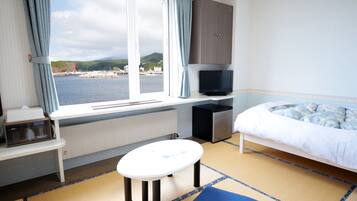 Down comforters, desk, blackout drapes, iron/ironing board