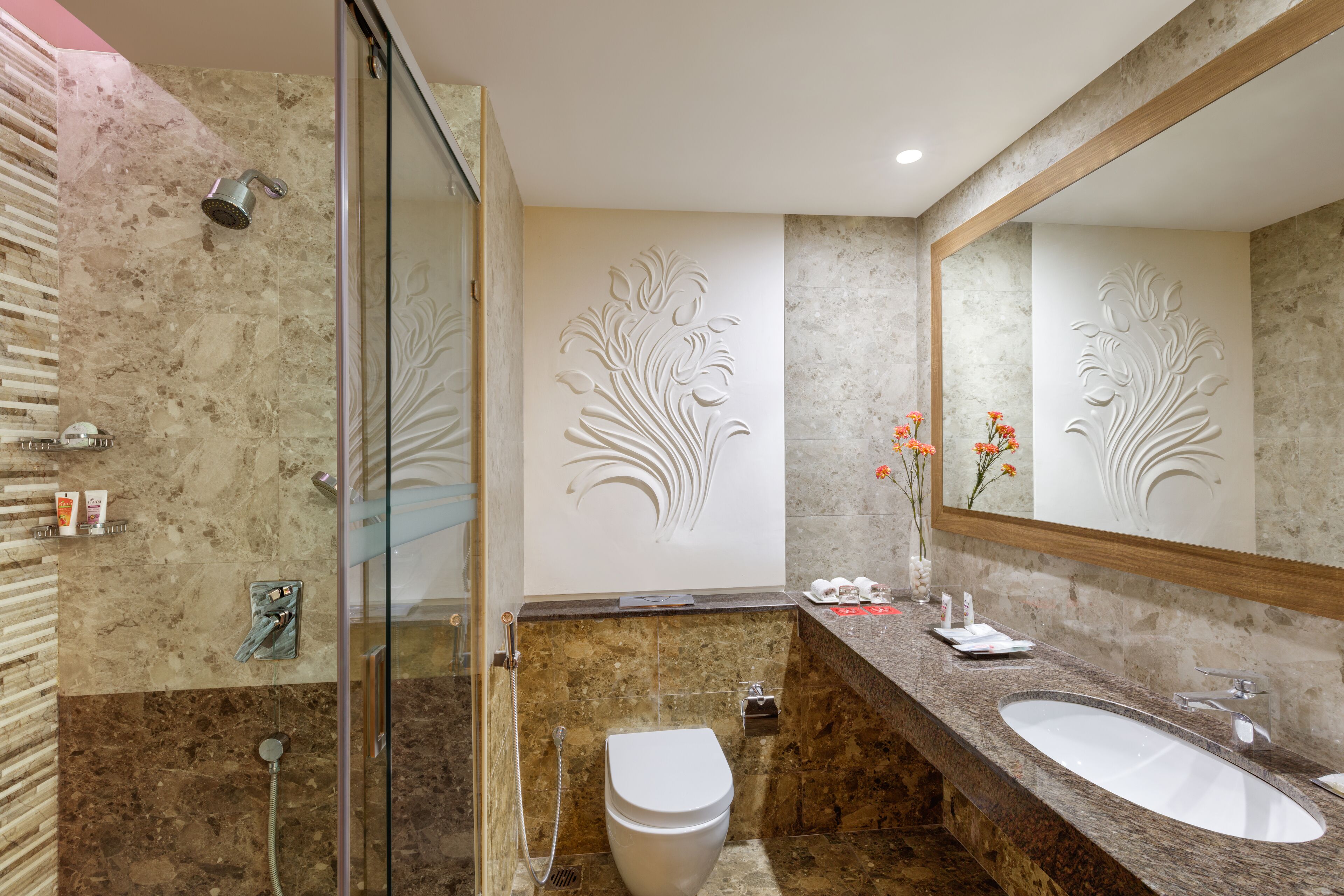 deep-soaking bathtub, designer toiletries, hair dryer, bathrobes