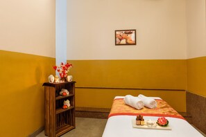 A hotel room with a bed, a small wooden shelf with decorative items, and a picture on the wall. - Welcomhotel by ITC Hotels, GST Road, Chennai (Chengalpattu)