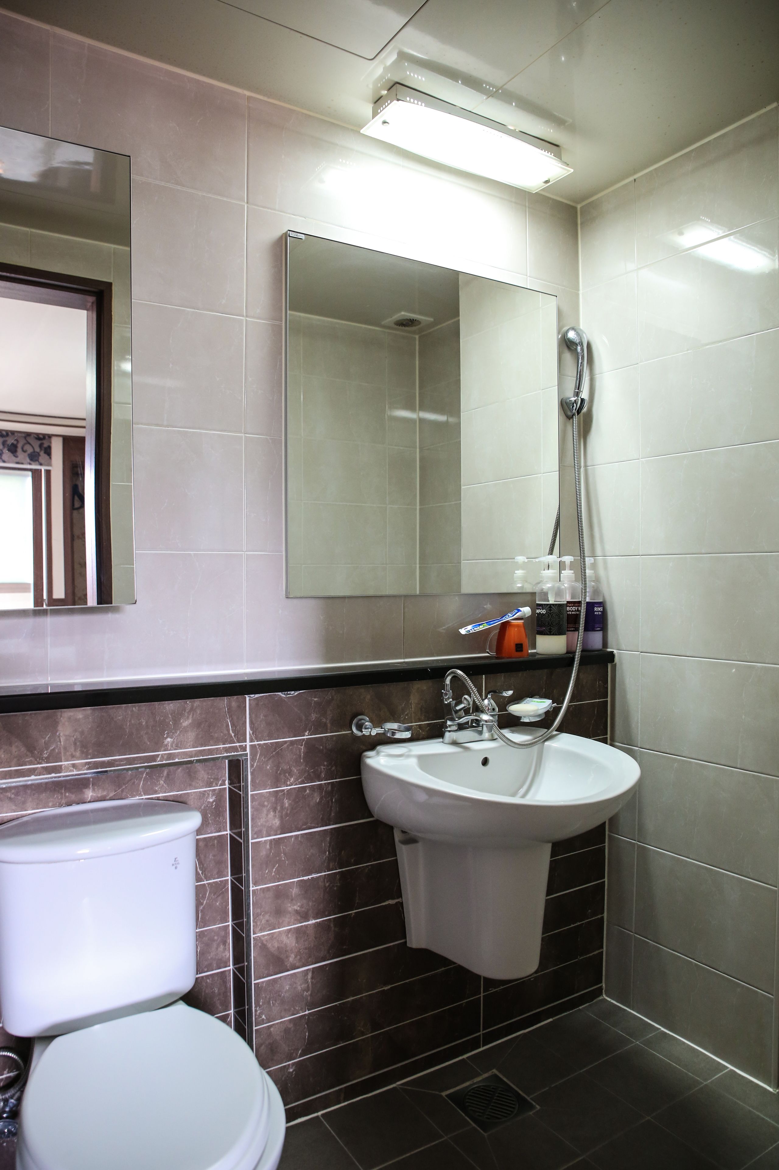 shower, hair dryer, slippers, towels