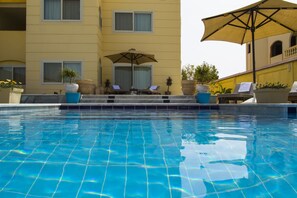Outdoor pool, pool umbrellas, pool loungers