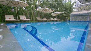 Outdoor pool, open 6 AM to 9 PM, pool umbrellas, sun loungers