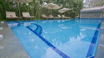 Outdoor pool, open 6 AM to 9 PM, pool umbrellas, pool loungers