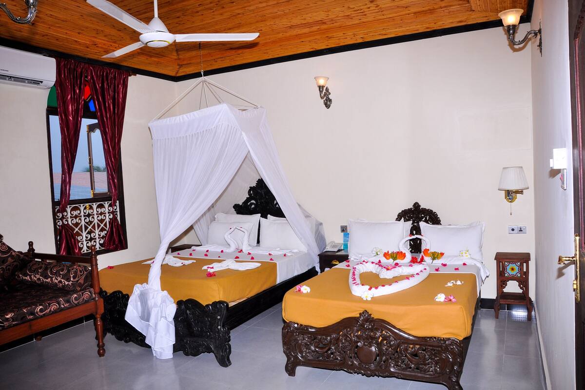 Family Triple Room | Premium bedding, minibar, in-room safe, desk