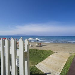 On the beach, sun-loungers, beach umbrellas, beach towels