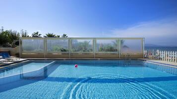 Seasonal outdoor pool, pool umbrellas, sun loungers