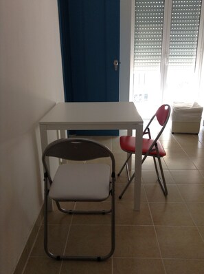 Studio, Balcony, City View | Living area | Flat-screen TV