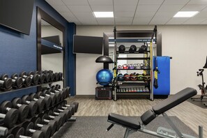 A gym with weightlifting equipment, exercise balls, and a bench. - Hampton Inn & Suites Pittsburgh/Harmarville (Pittsburgh)