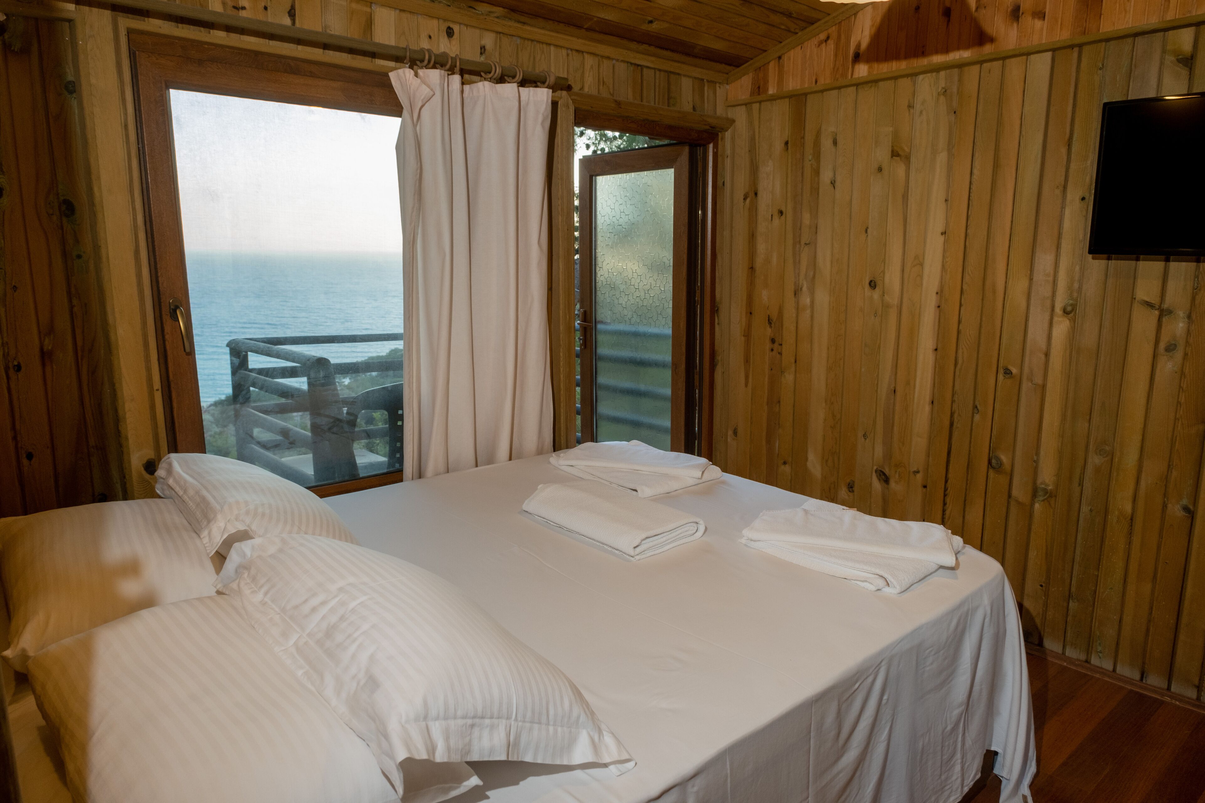 comfort room, 1 double bed, sea view | 1 bedroom, premium bedding, free minibar items, blackout curtains