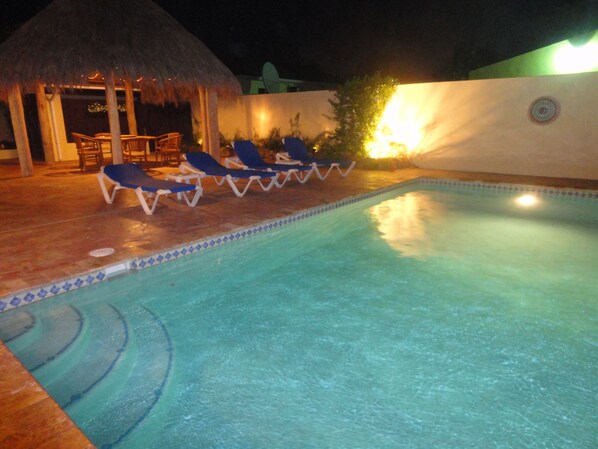 Outdoor pool, a heated pool, sun loungers