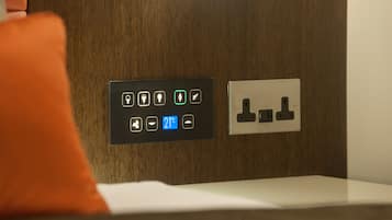 A control panel with various icons and a digital display showing 21°C.