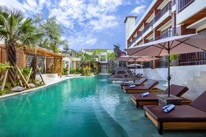 Outdoor pool, open 7:00 AM to 6:00 PM, pool umbrellas, pool loungers