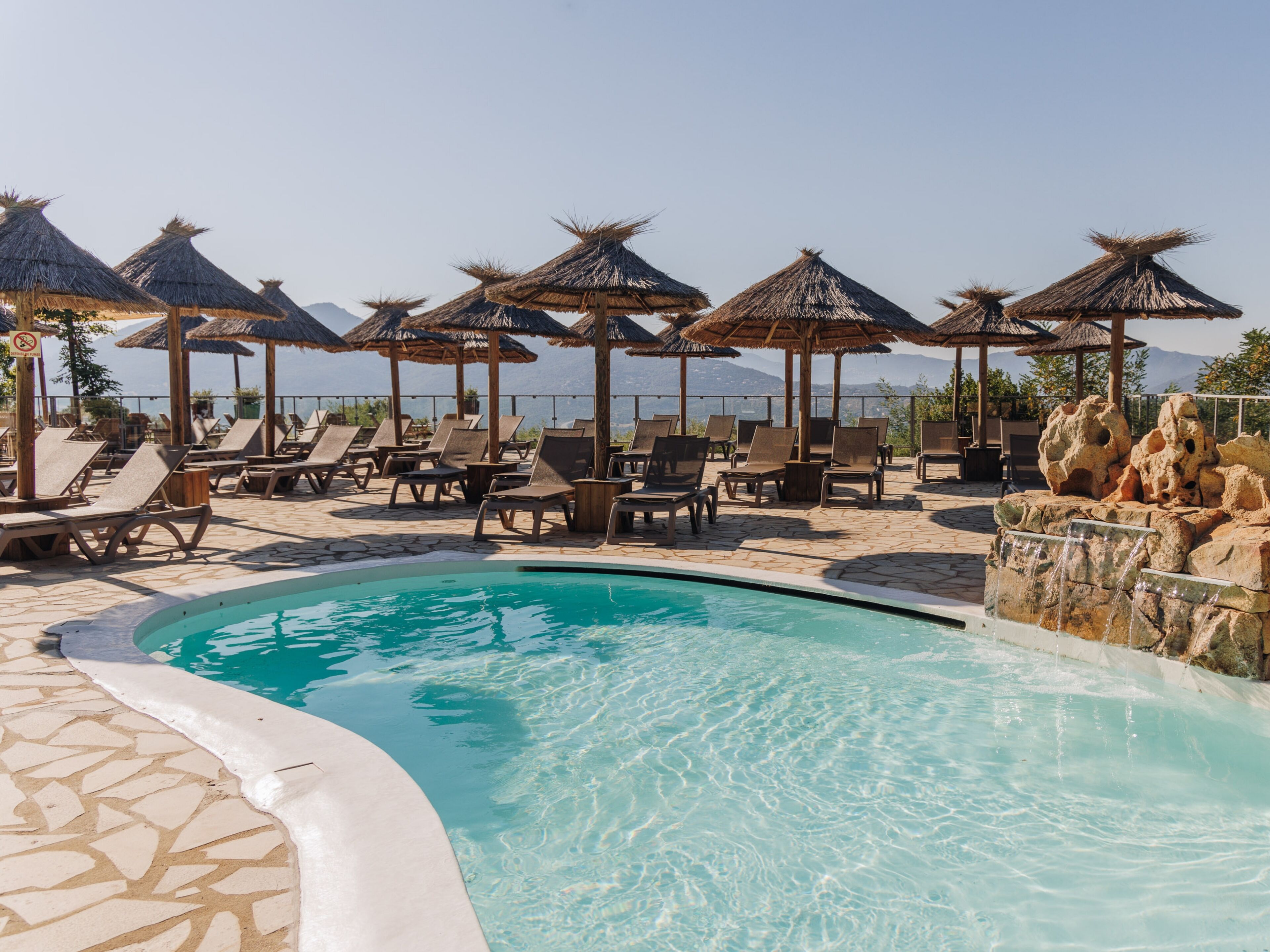 3 outdoor pools, open 10:00 AM to 7:00 PM, pool umbrellas, pool loungers