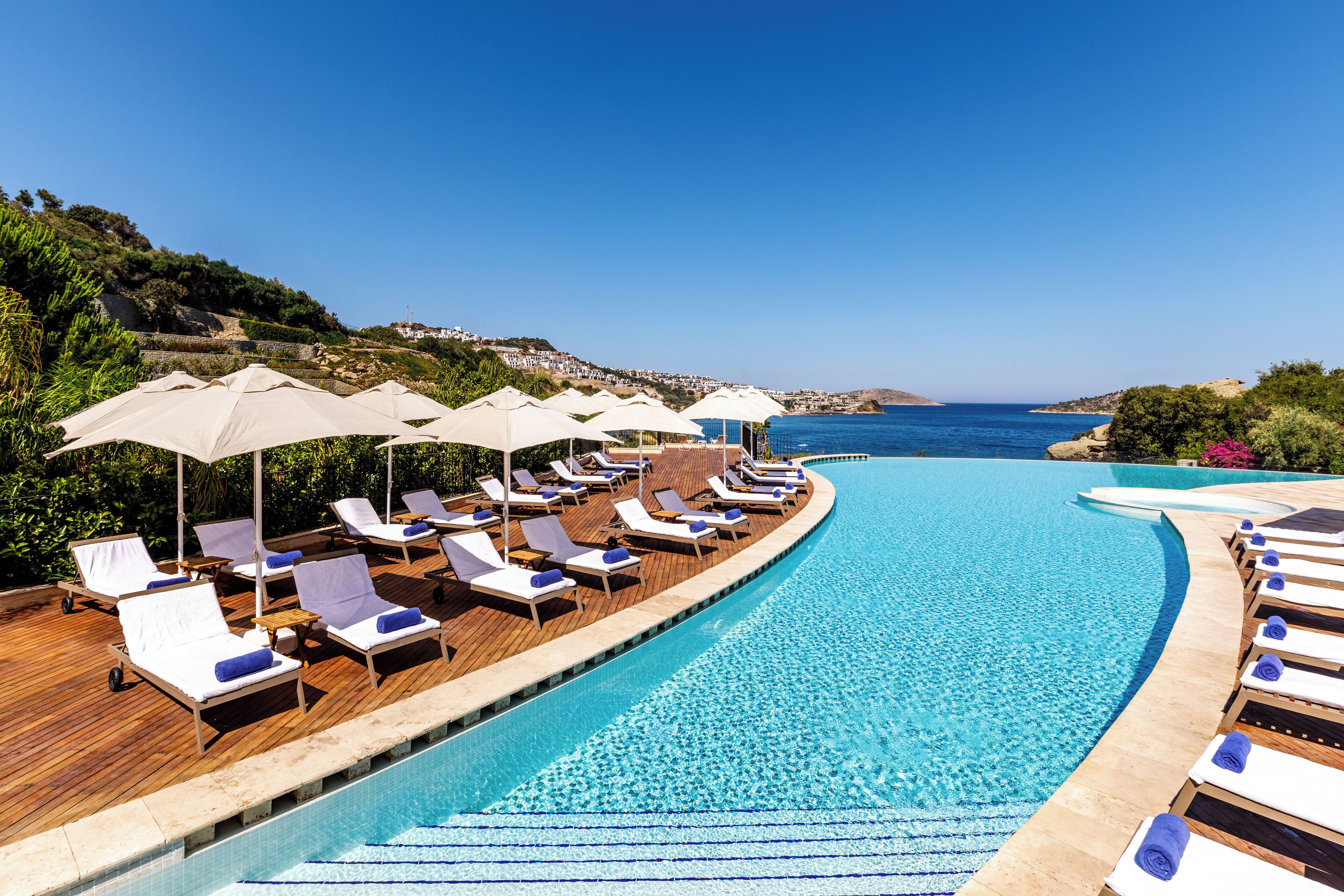 indoor pool, seasonal outdoor pool, pool umbrellas, pool loungers