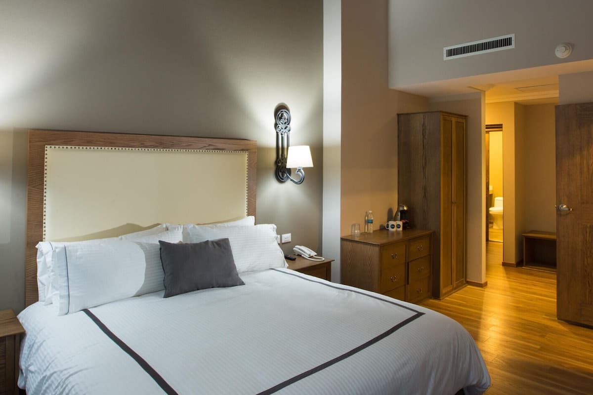 Premium bedding, down duvets, in-room safe, desk