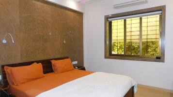 Premium bedding, down duvets, memory-foam beds, in-room safe