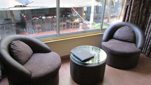 Grandeur Honeymoon Fantasy with Bathtub | Living area | LED TV