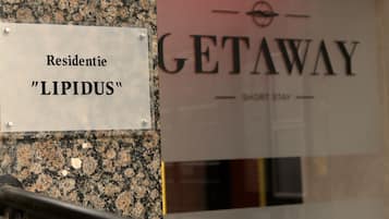 A sign for "GETAWAY" and "LIPIDUS" residence.