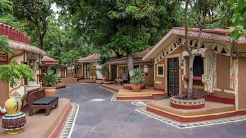 A courtyard with traditional architecture, including patterned walls and tiled flooring.