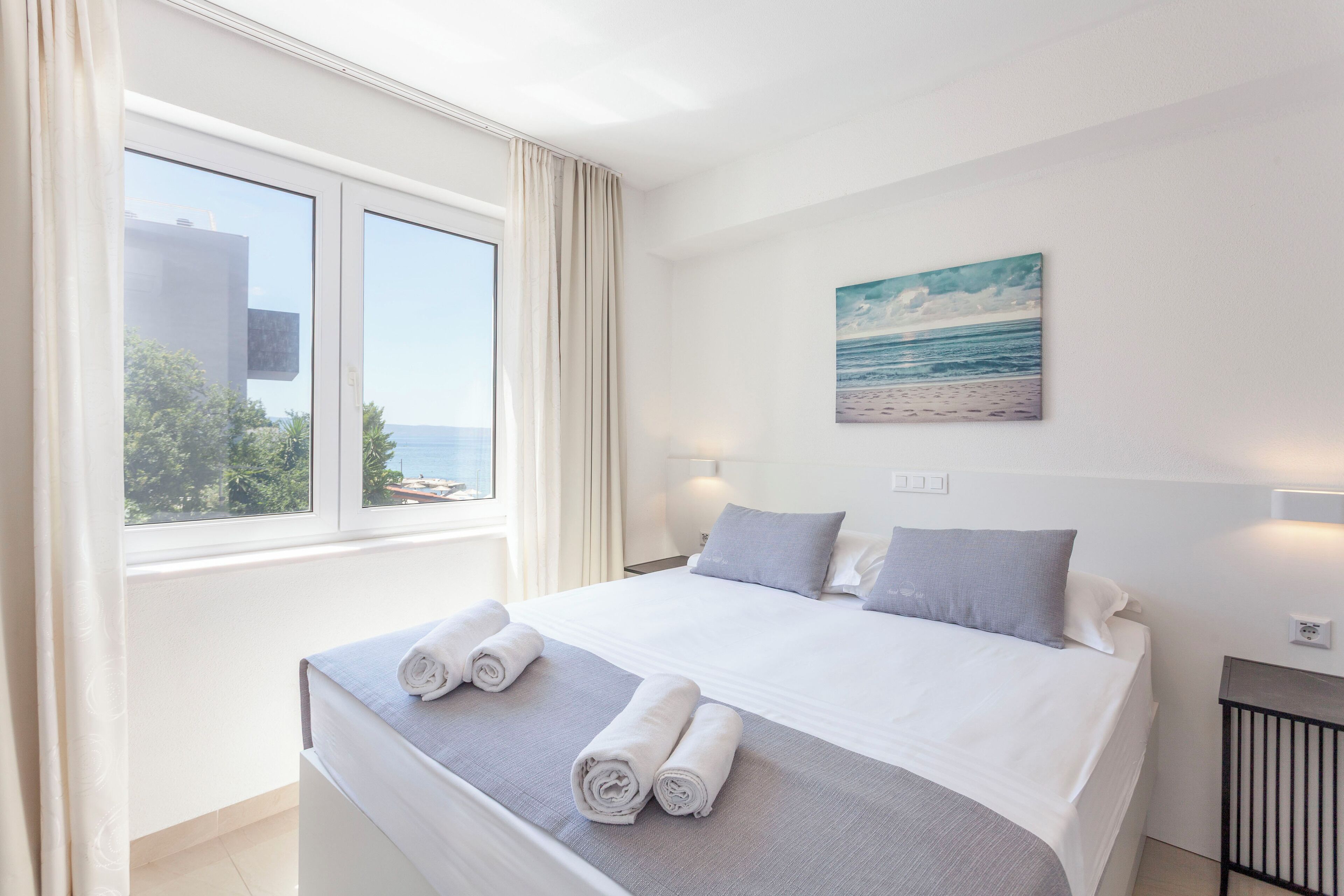 Chambre Quadruple, 2 chambres, balcon, vue mer | Vue sur la plage/l’océan