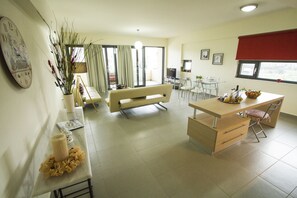 Apartment, 1 Bedroom (Bellarea Bella Vista) | Living area | Flat-screen TV