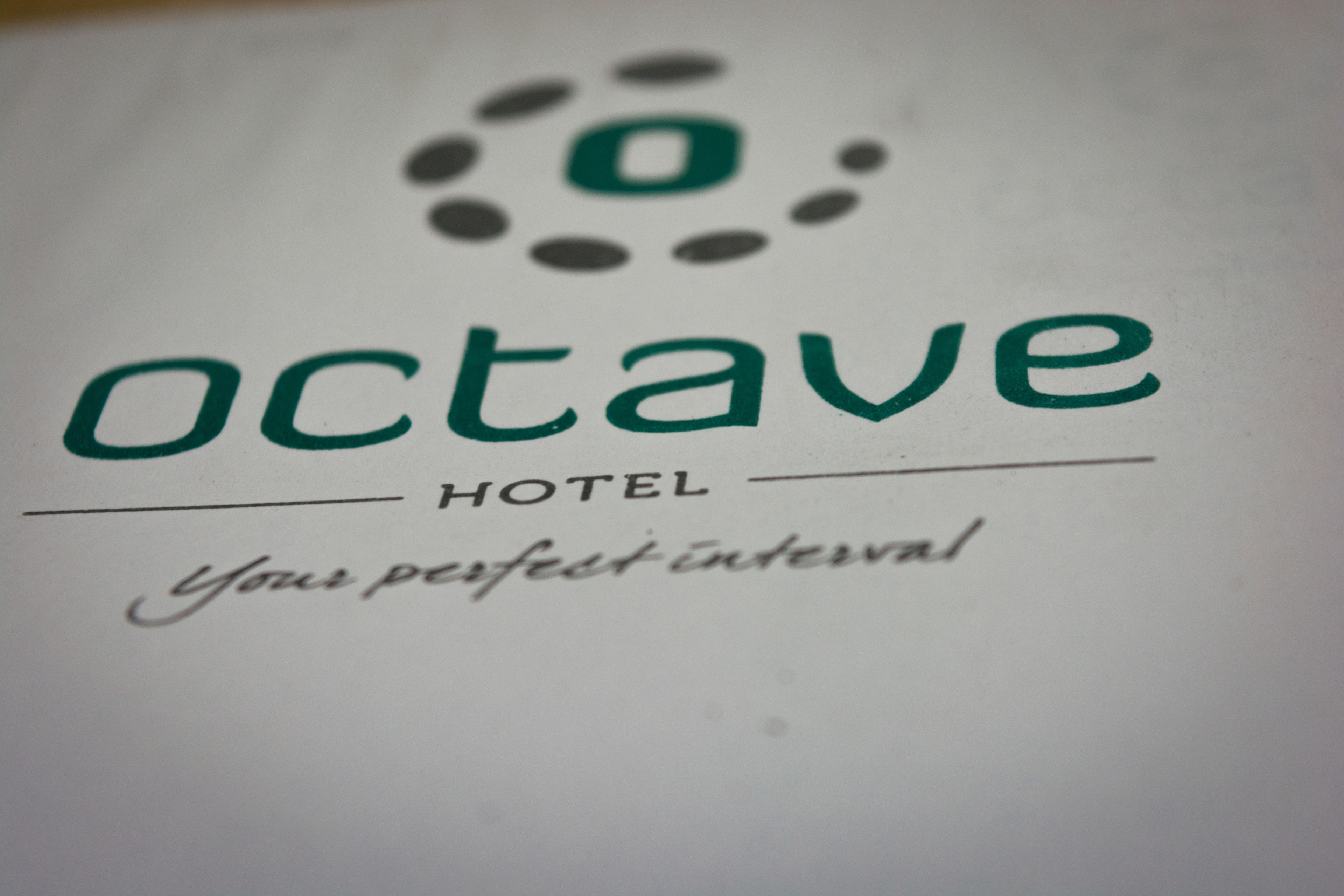 A hotel sign with the name "octave" and the tagline "your perfect interval".