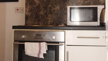 Apartment, Private Bathroom | Private kitchenette | Full-size fridge, microwave, oven, stovetop