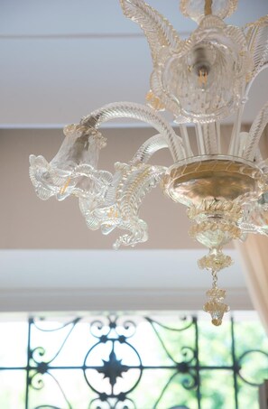 A chandelier with intricate crystal details. - La Villa di STR (Siena)