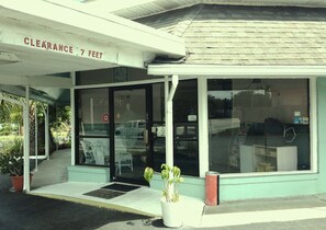 A building with a clear sign indicating a 7 feet clearance.