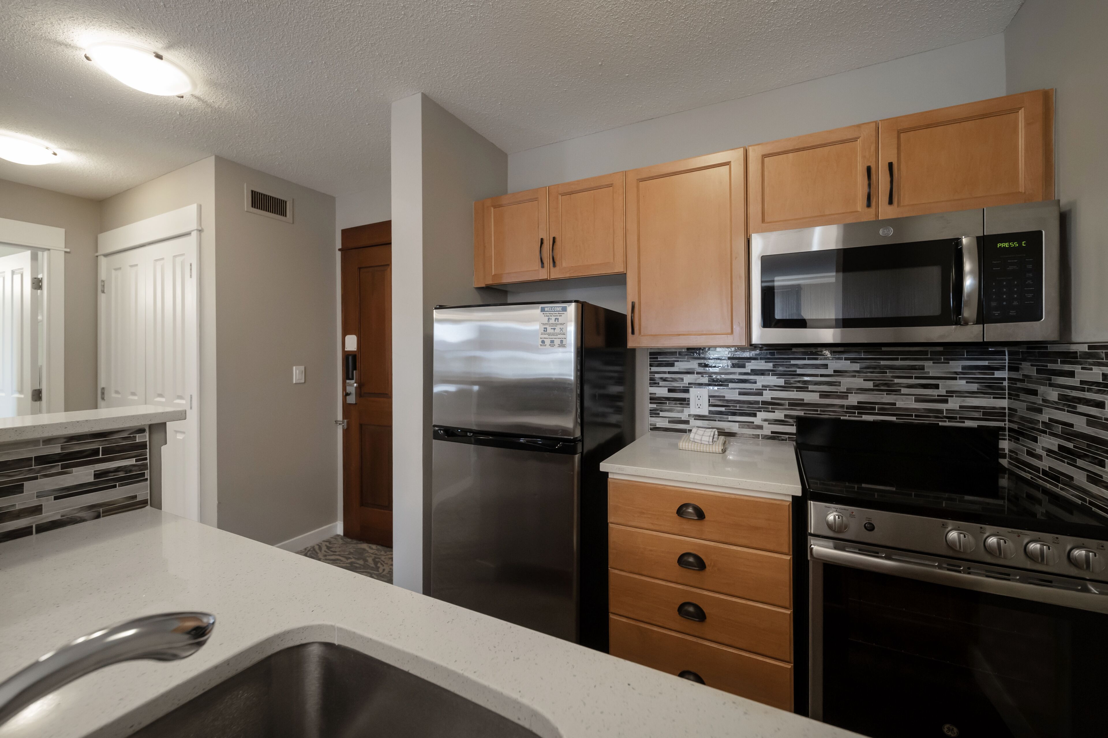 village suites one bedroom with full kitchen | private kitchen | microwave, coffee/tea maker, electric kettle, toaster