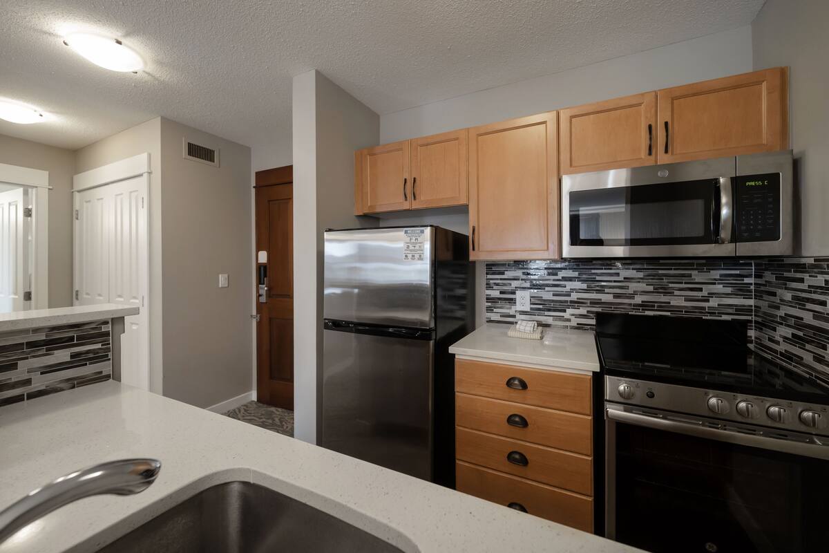 village suites one bedroom with full kitchen | private kitchen | microwave, coffee/tea maker, electric kettle, toaster