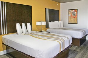 Premium bedding, desk, laptop workspace, blackout drapes