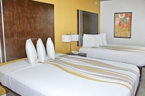 Premium bedding, desk, laptop workspace, blackout curtains