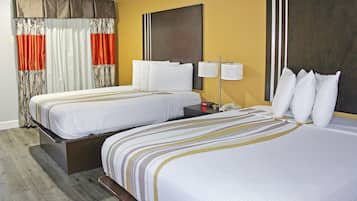 Premium bedding, desk, laptop workspace, blackout drapes