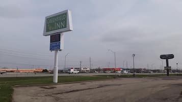 A Greenfield Inn sign with a digital display indicating Wi-Fi and HBO availability.