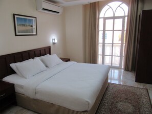 Family Apartment, 1 King Bed, City View | 1 bedroom, in-room safe, individually decorated, individually furnished - Alferdous Hotel Apartments (Muscat)
