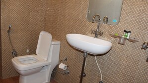 Deluxe Double Room, 1 King Bed | Bathroom | Shower, free toiletries, slippers, bidet - Pacific Inn Huda City Centre Sec 41 (Gurugram)