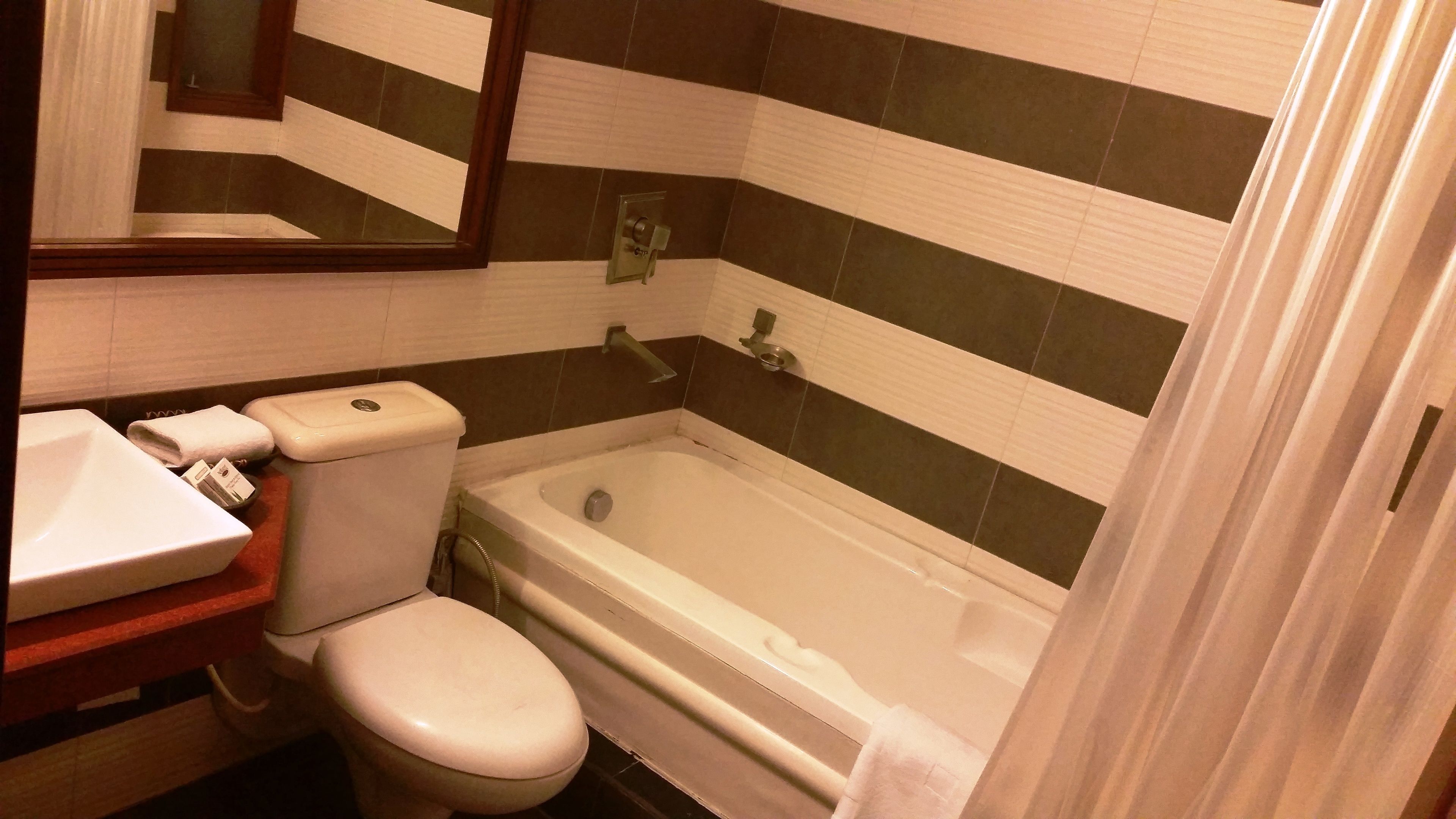 designer toiletries, hair dryer, bathrobes, slippers