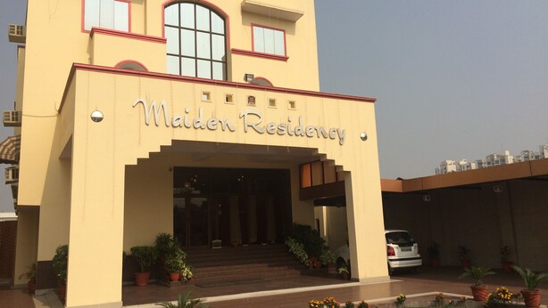 Un immeuble sur lequel on peut lire l’inscription « Résidence Maiden ».